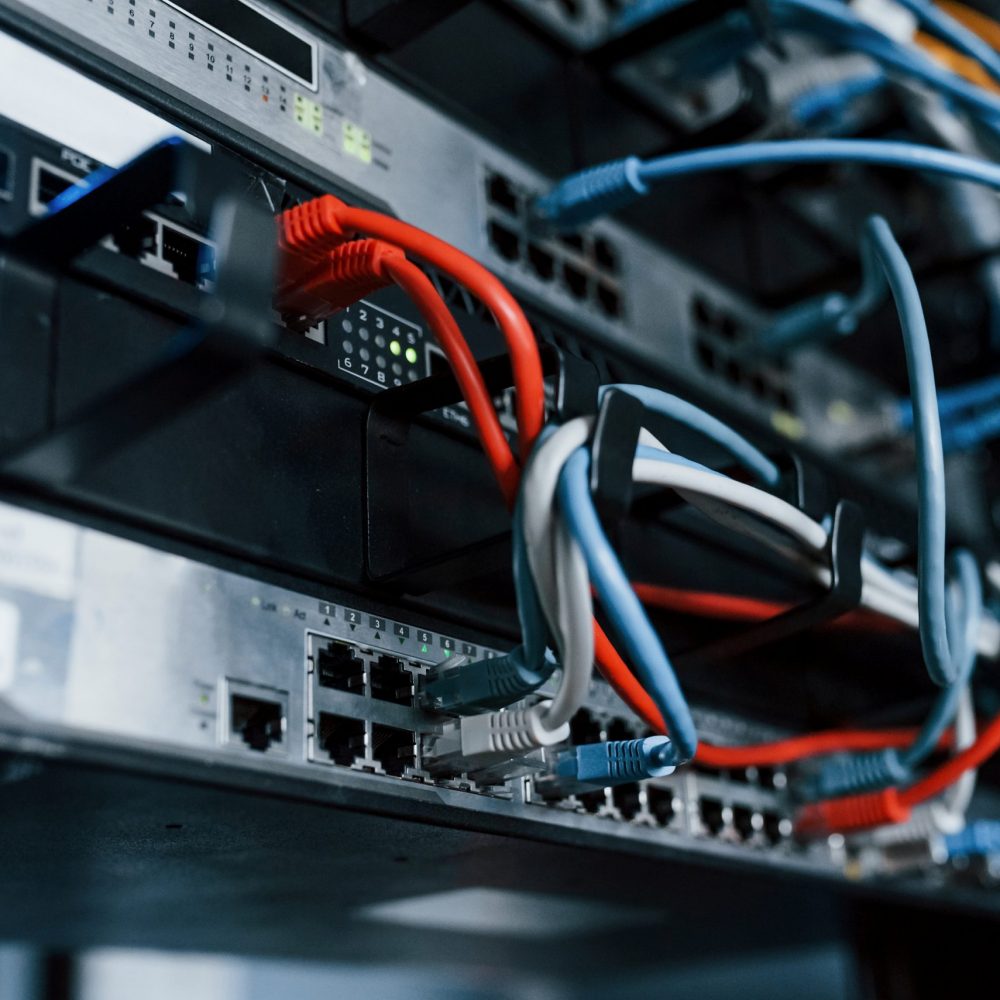 Close up view of internet equipment and cables in the server room.